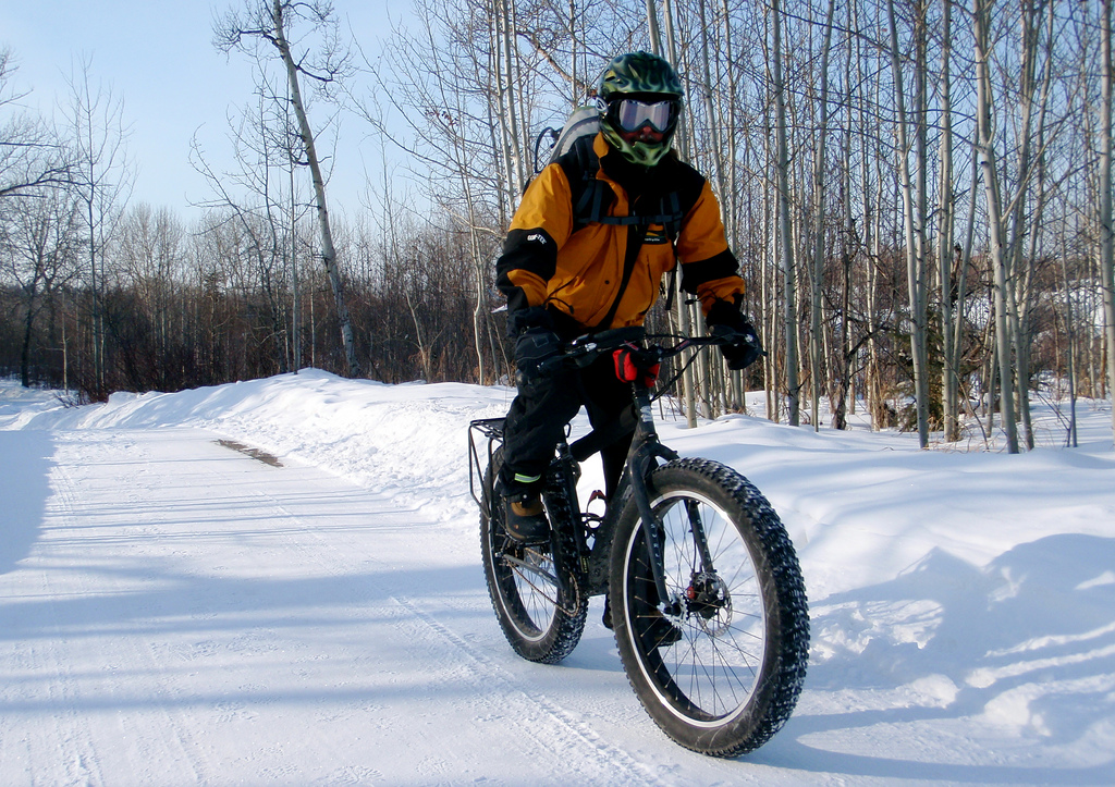 Rider on a fat tire bike doing winter trail riding