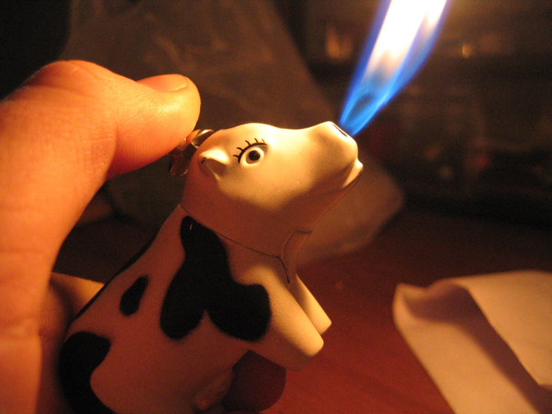 novelty cigarette lighter in the shape of a cow
