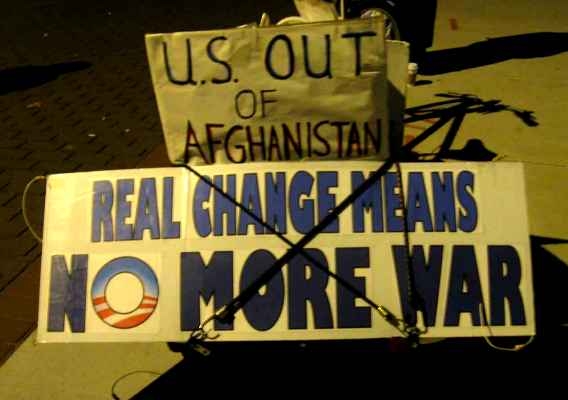 Activists march in opposition to Obama’s troop surge decision