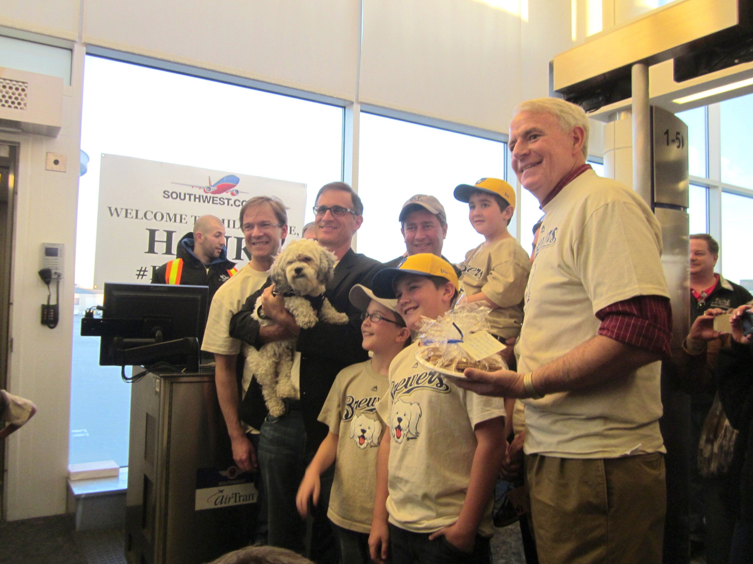 Milwaukee Mayor Tom Barrett meets "Hank," the Brewers unofficial new mascot, returning from spring training.