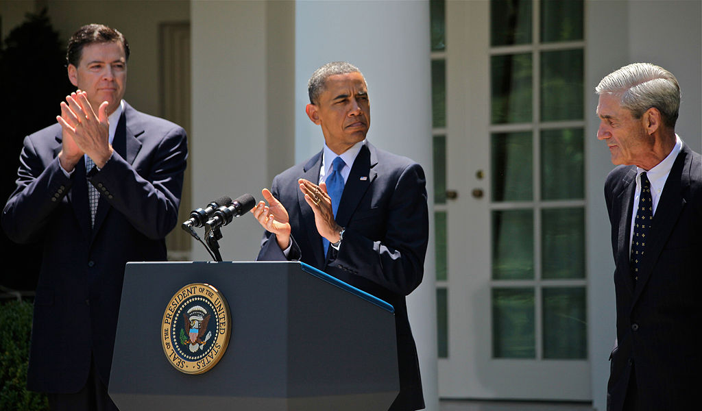 Former Deputy Attorney General James Comey (left), alongside President Barack Obama (center) and outgoing FBI Director Robert Mueller (right) at Comey's nomination to become the seventh director of the FBI, 26 September 2013.