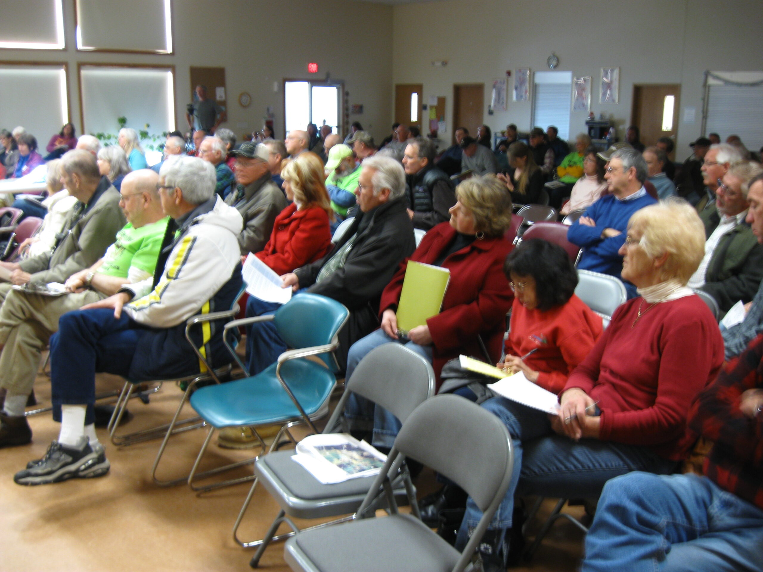 Citizens demand cleanup of groundwater contamination at a DNR hearing in Adams County.