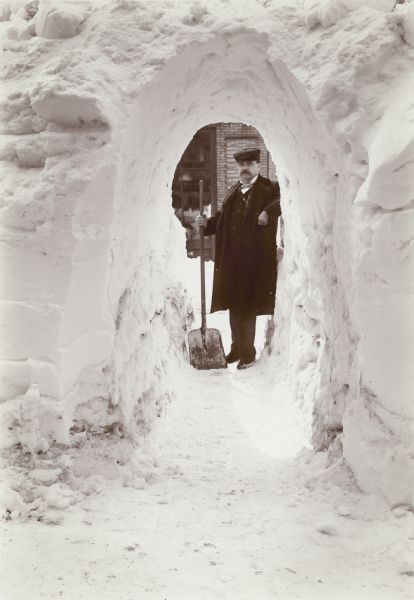 man tunneling through the snow