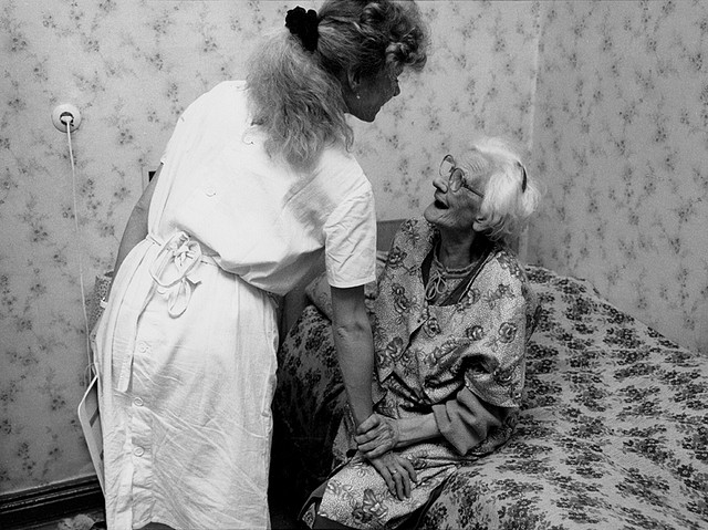 nurse helping older patient