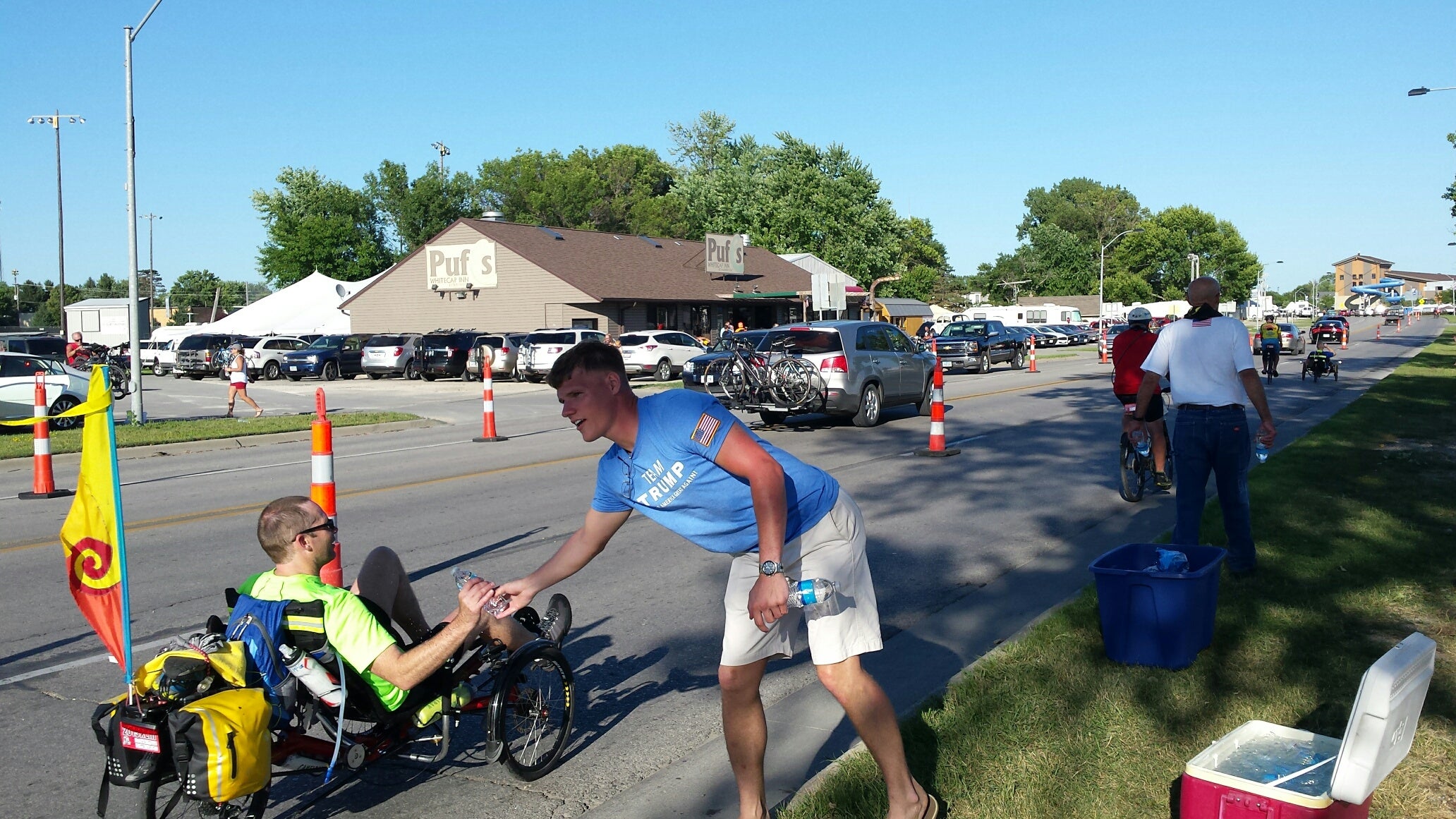 Donald Trump voluteer hands water to a BKE RIDER