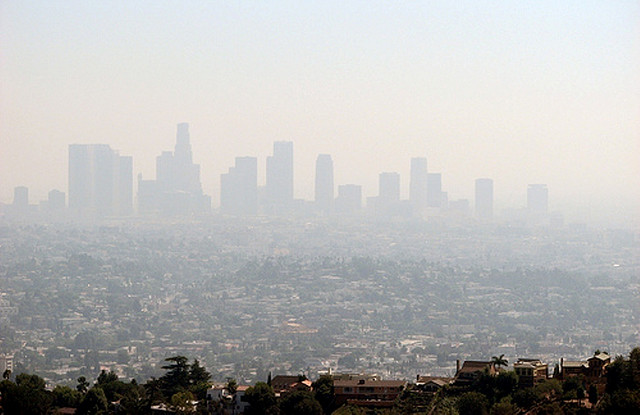 air pollection against a city landscape