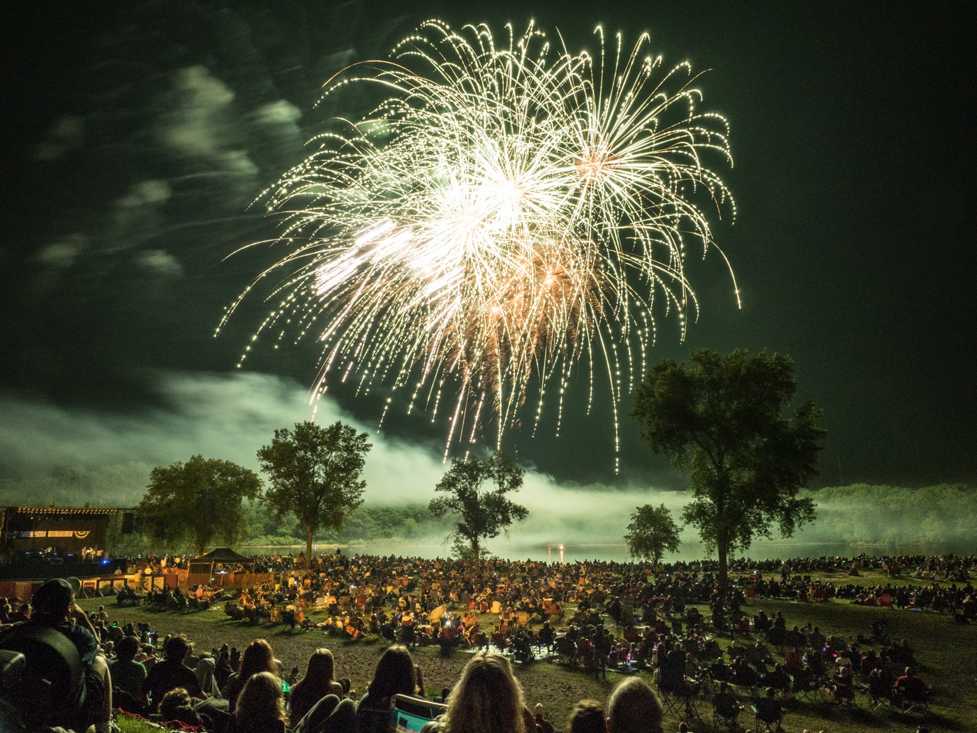 image of fireworks exploding over a crowd
