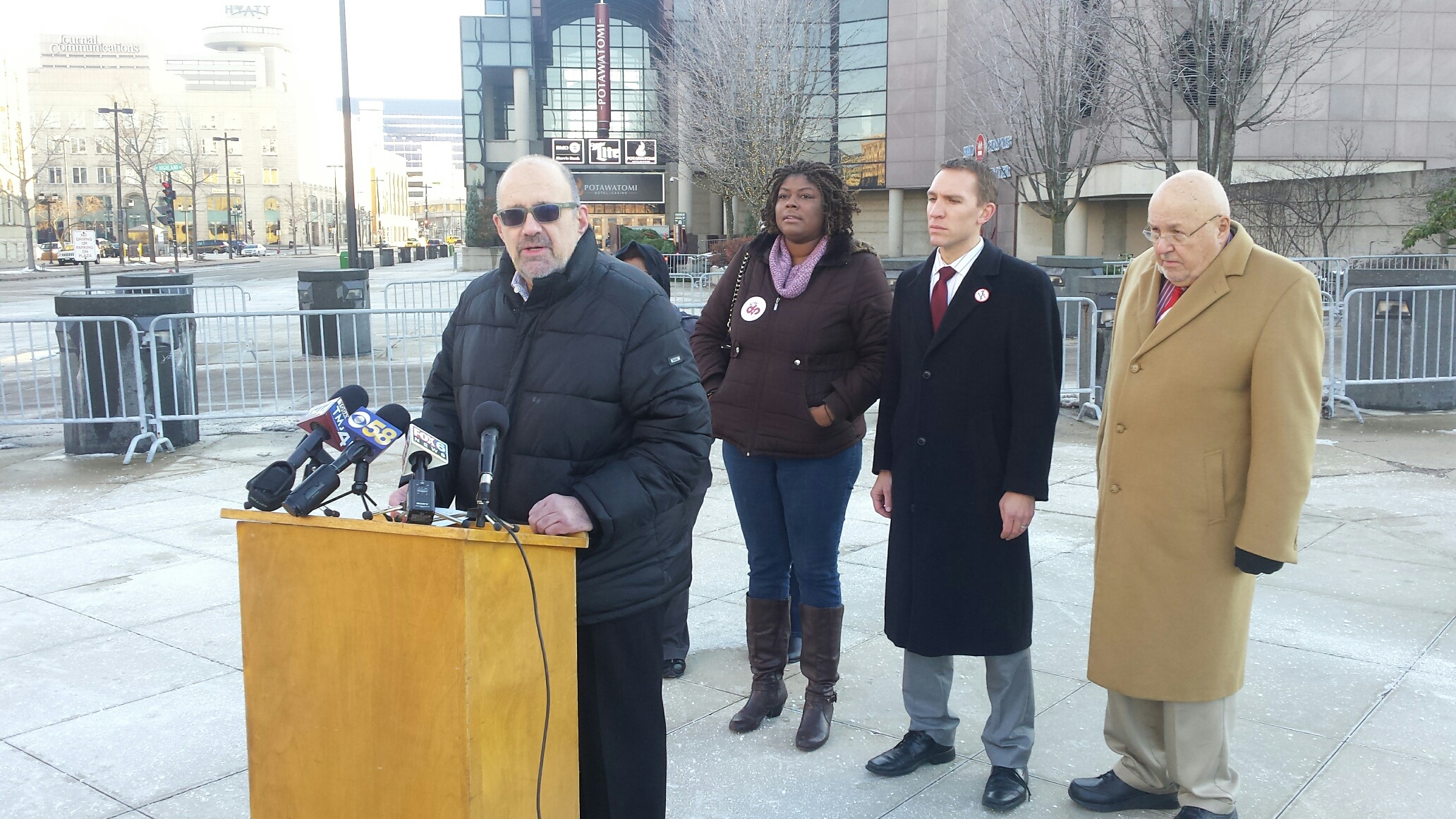Bruce Colburn of the SEIU speaks at a news conference outside Milwaukee's Bradley Center.