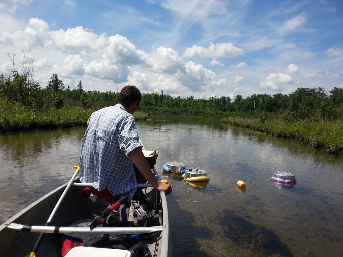 Nick Gubbins, an undergraduate student who has worked in the Stanley lab, takes methane flux measurements in the field. Photo credit: Luke Loken, UW-Madison Center for Limnology