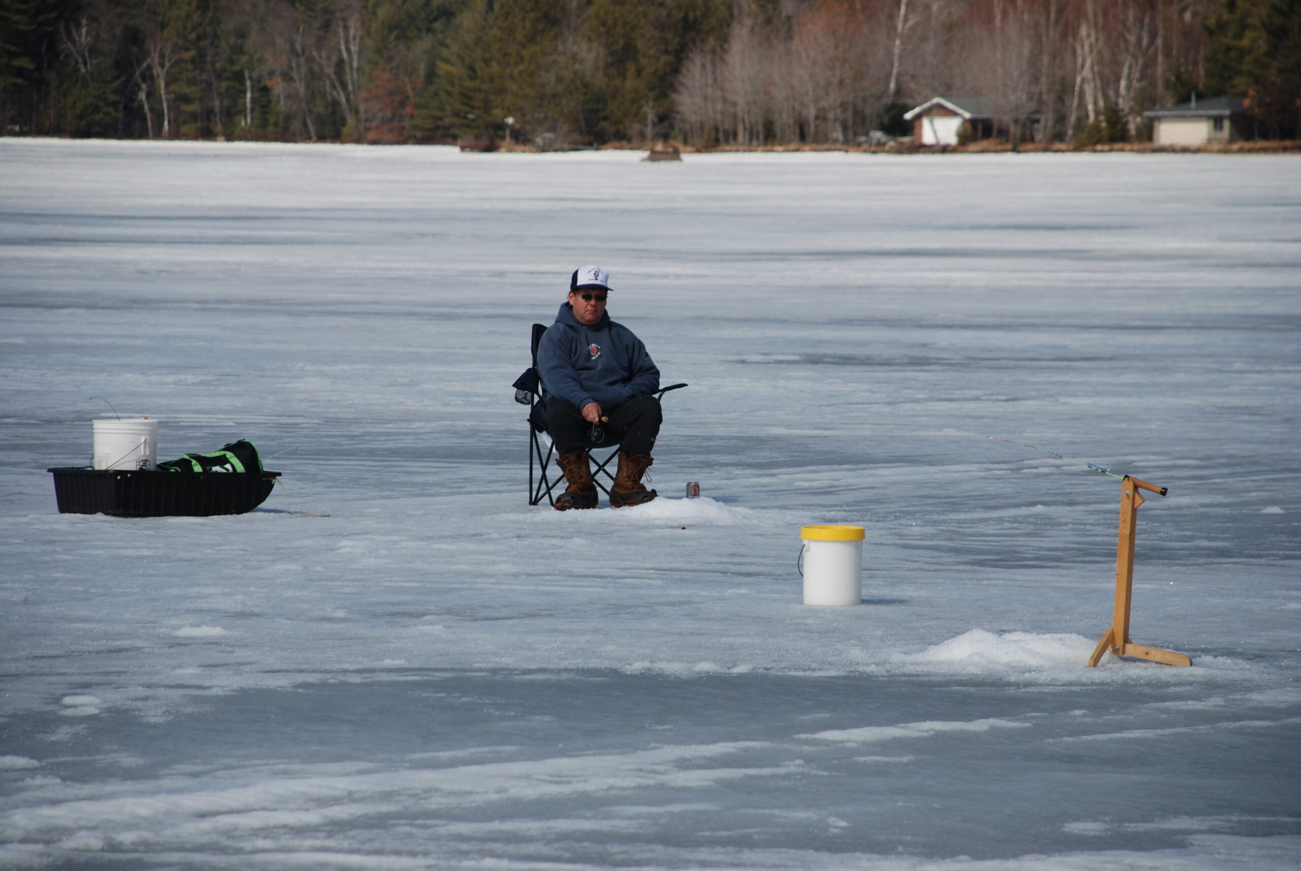 Man Ice Fishing In Wisconsin