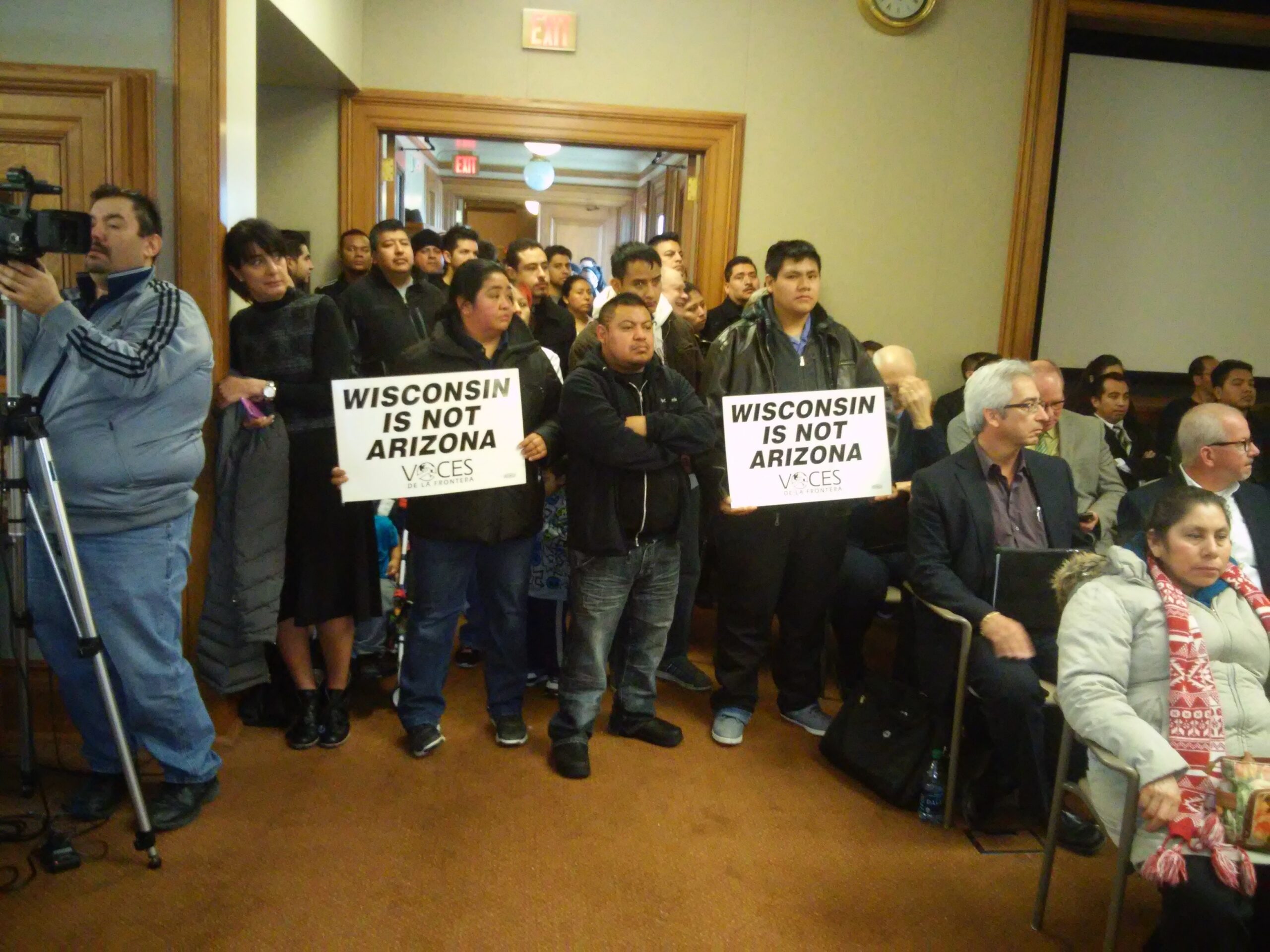 protesters pack a hearing room in Madison.