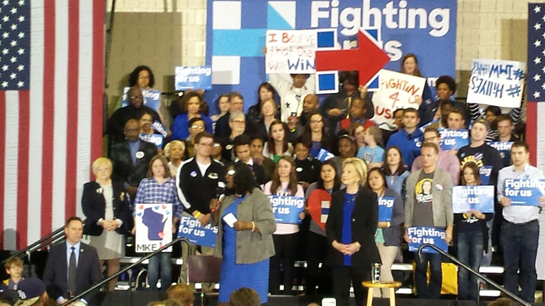 Hillary Clinton listens to Rep. Gwen Moore