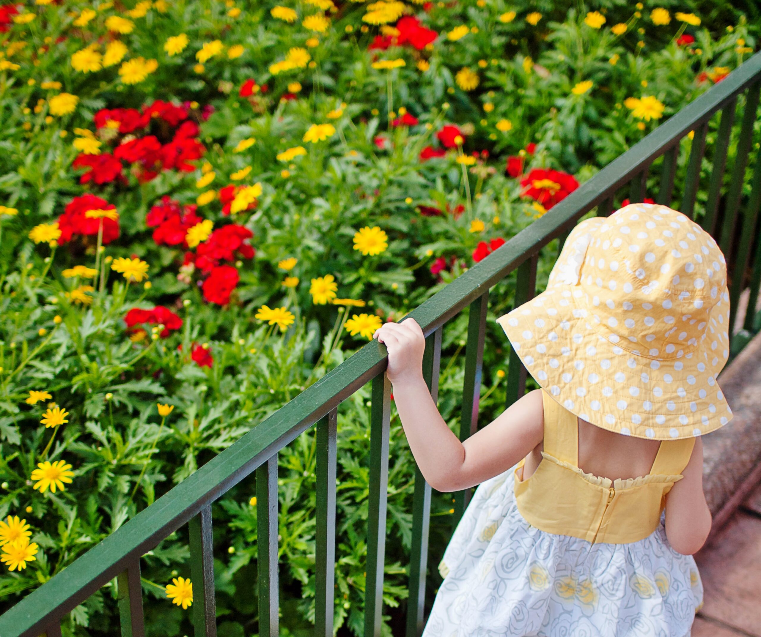 Girl Looking at Flowers