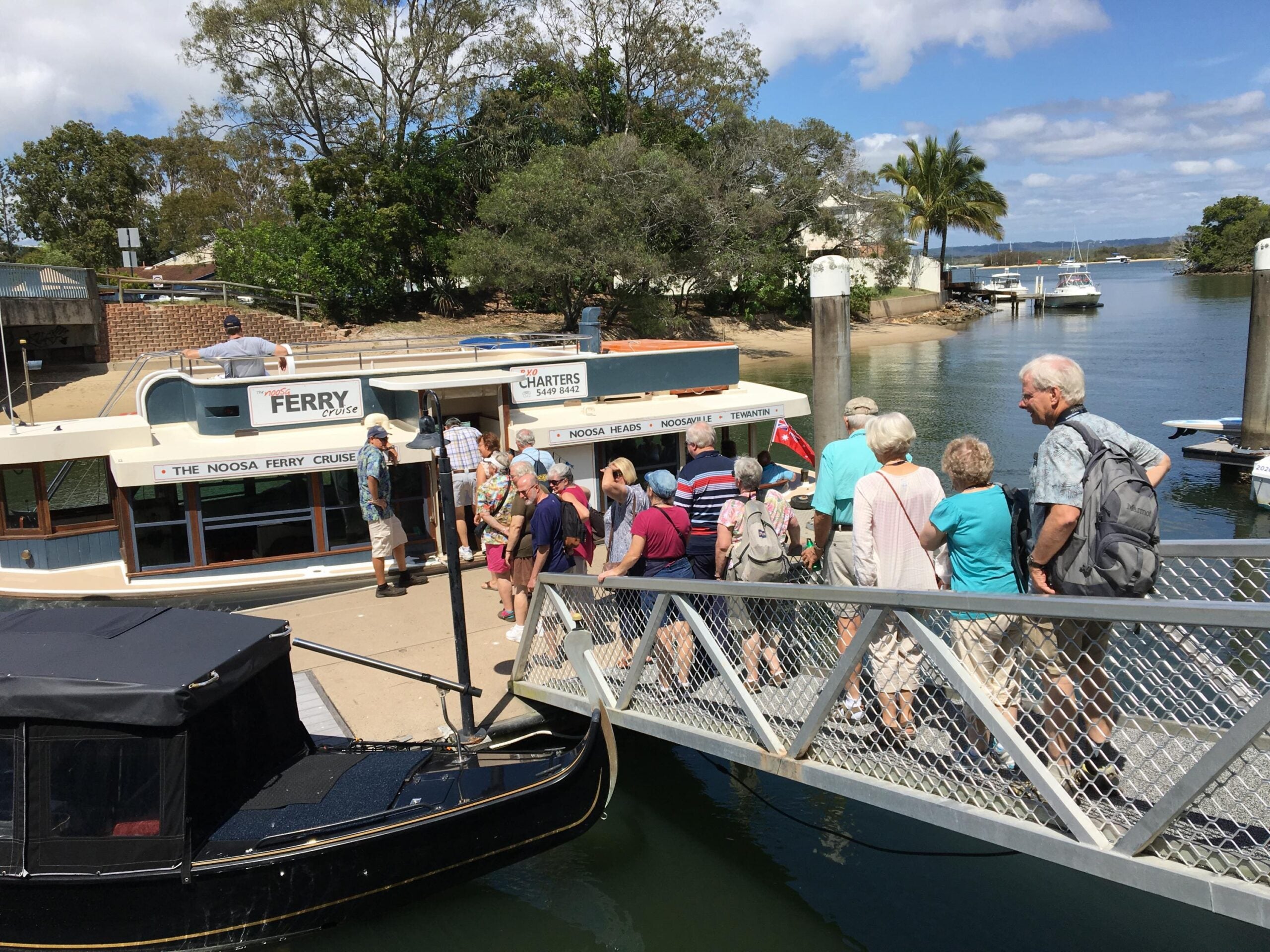 Boarding a Noosa River 
