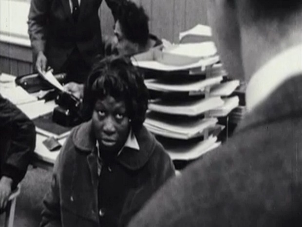 A screenshot from the 1968 documentary "Pretty Soon Run Out," showing a Milwaukee resident speaking with city officials about housing