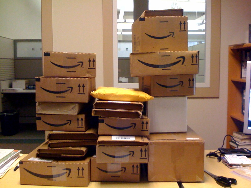 Amazon boxes stack up in office