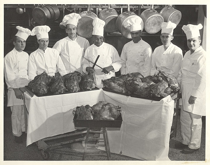 Carson Gulley poses with his chefs and a number of roast turkeys for Thanksgiving in November 1947.