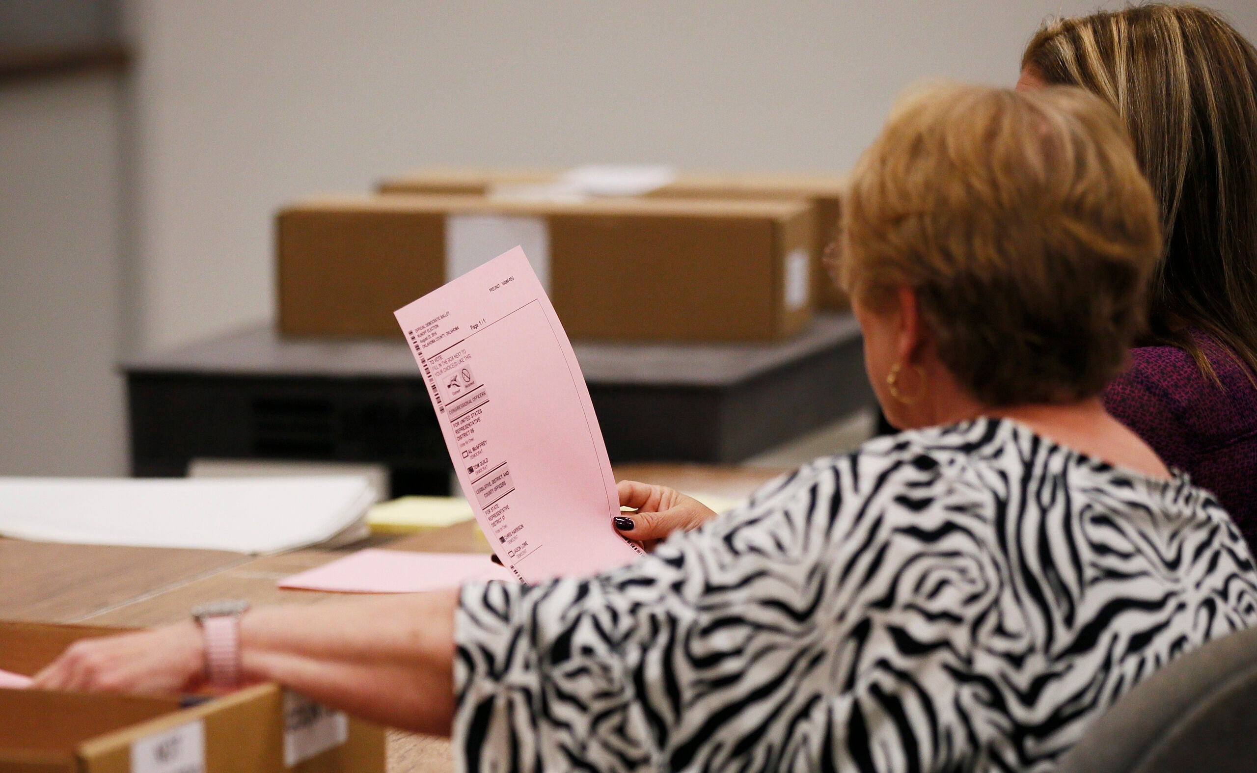 People recounting ballots