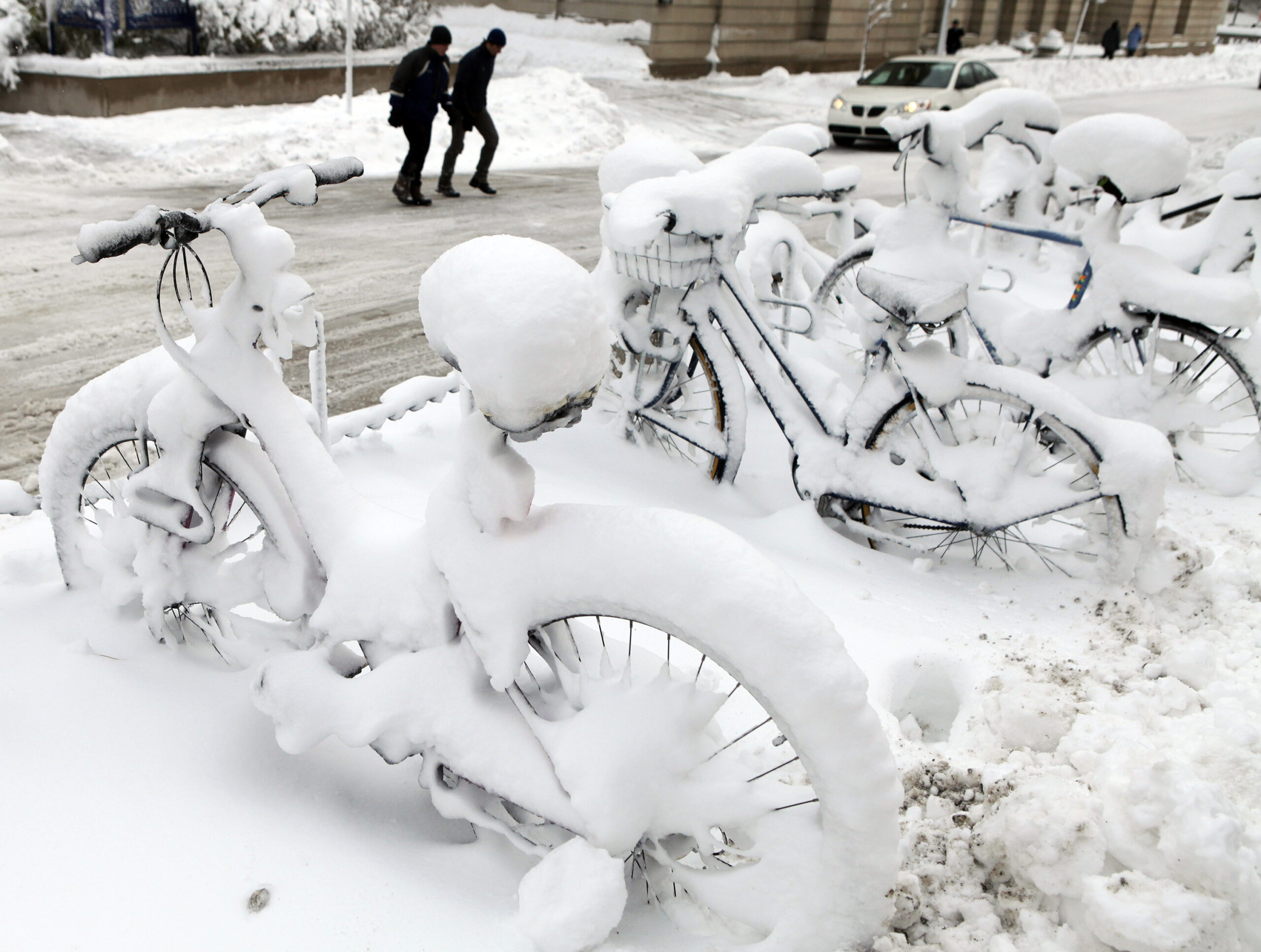 Snow-covered bikes