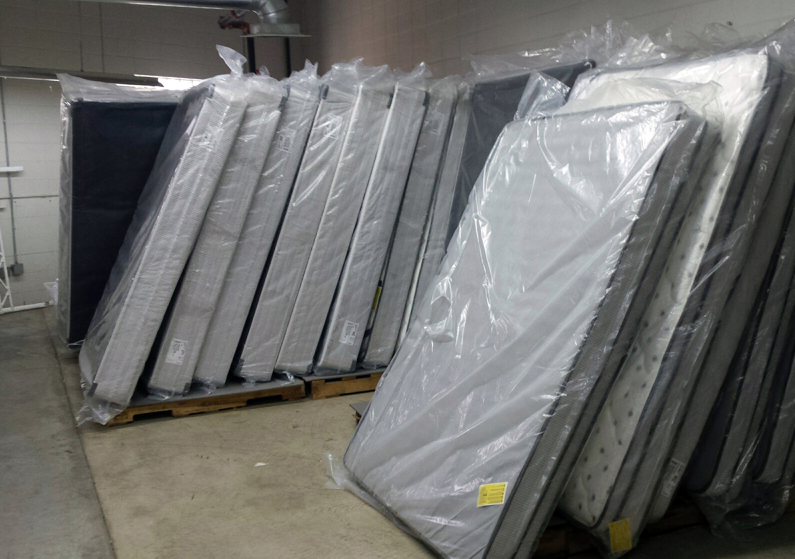 Donated mattresses in Milwaukee Homeless Veterans Initiative warehouse