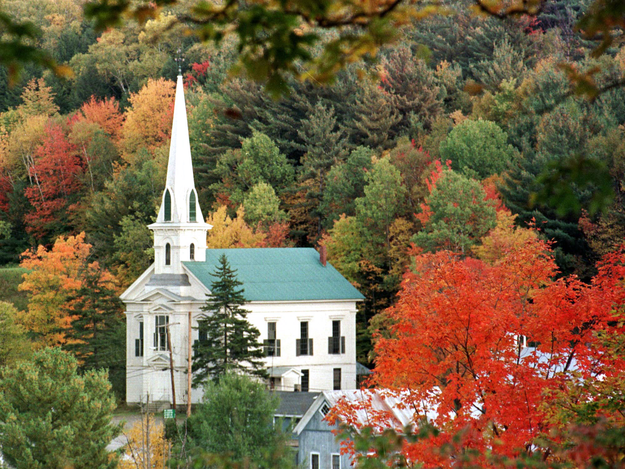 Colors of fall seen on trees frame a church
