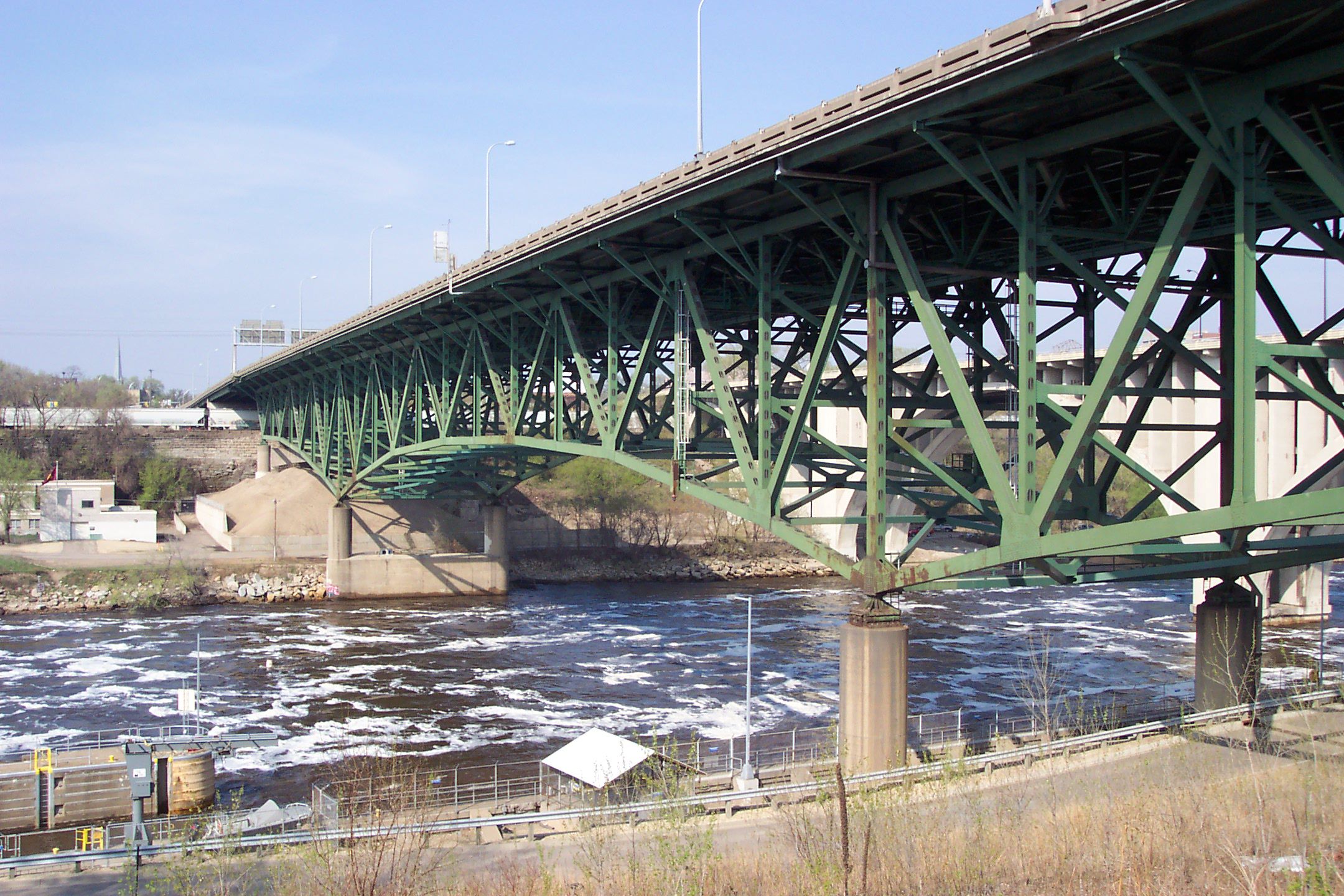 This 2005 image provided by John Weeks III shows the I-35W bridge north of Minneapolis. The busy highway bridge that spans the Mississippi River just northeast of Minneapolis collapsed during rush hour Wednesday, Aug. 1, 2007 sending dozens of cars, tons
