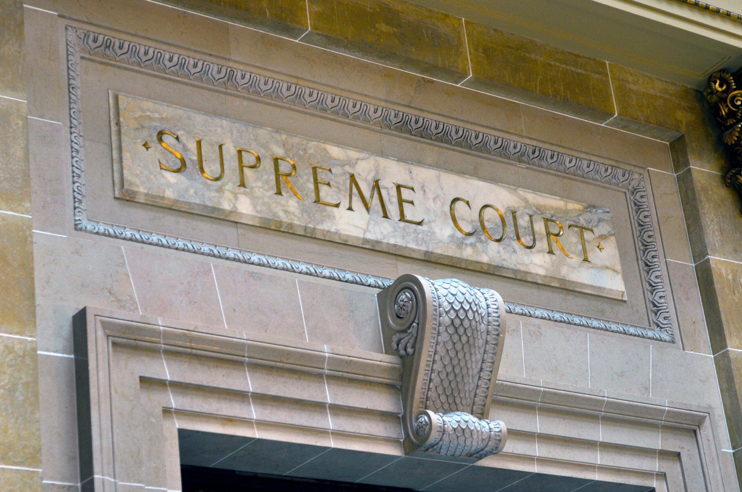 "Supreme Court" engraved on wall