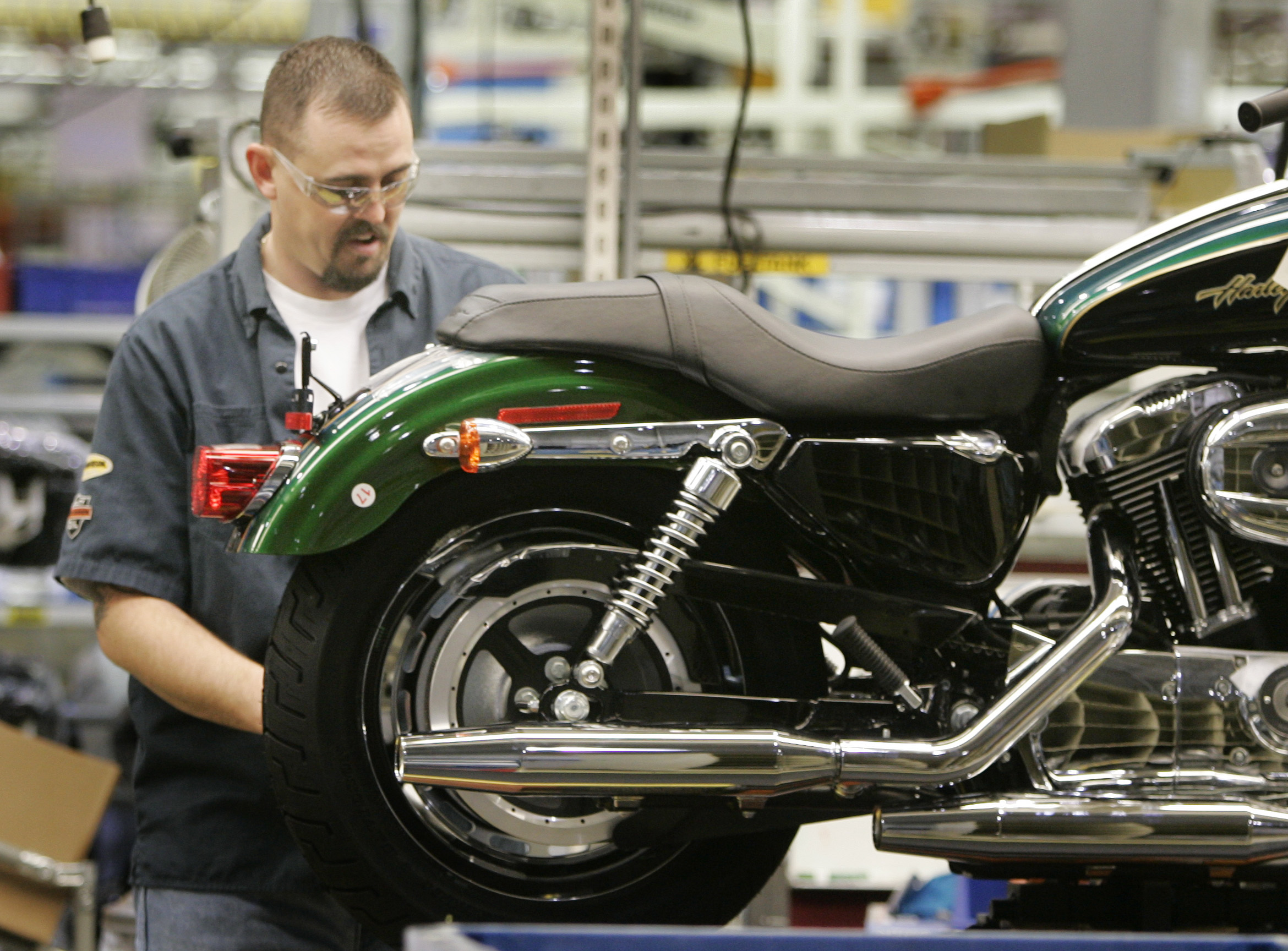 Man working on Harley Davidson motorcycle