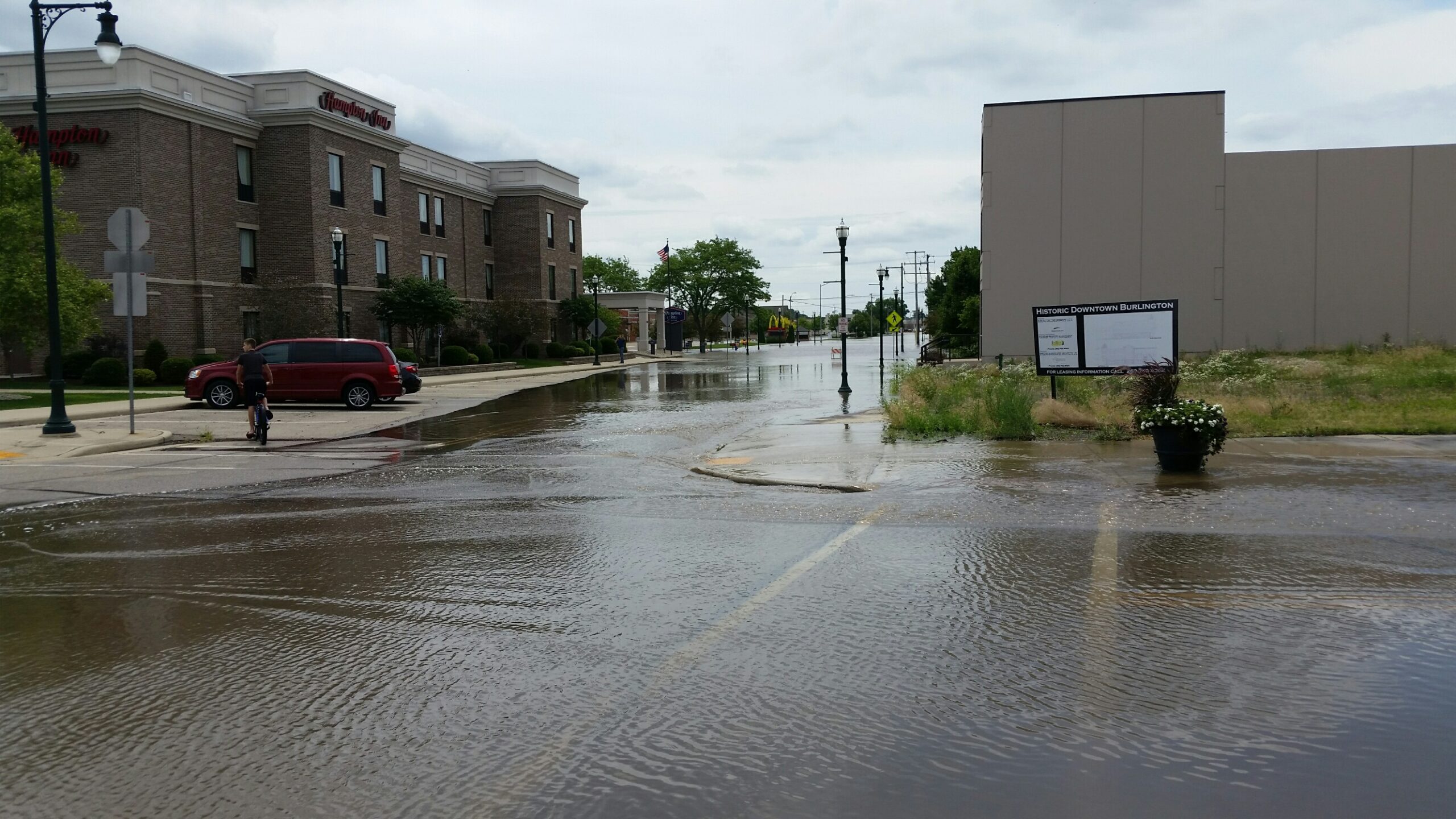 Streets in downtown Burlington, Wisconsin, remain flooded