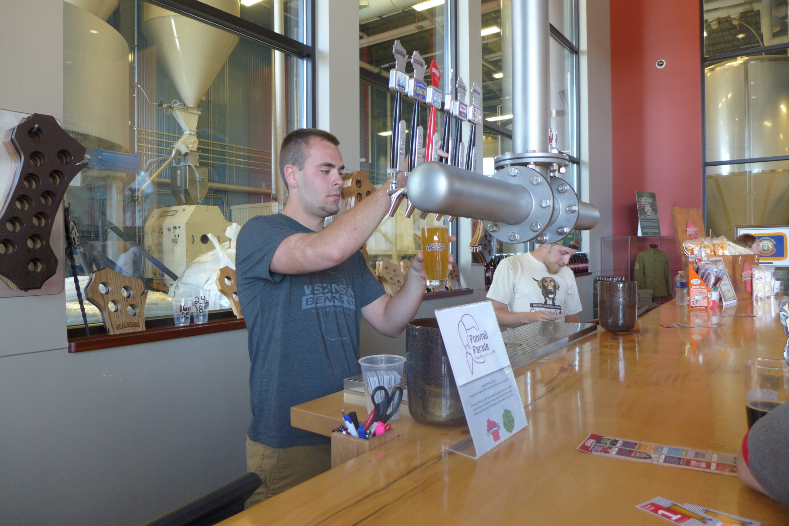 Bartender pouring a beer at Wisconsin Brewing