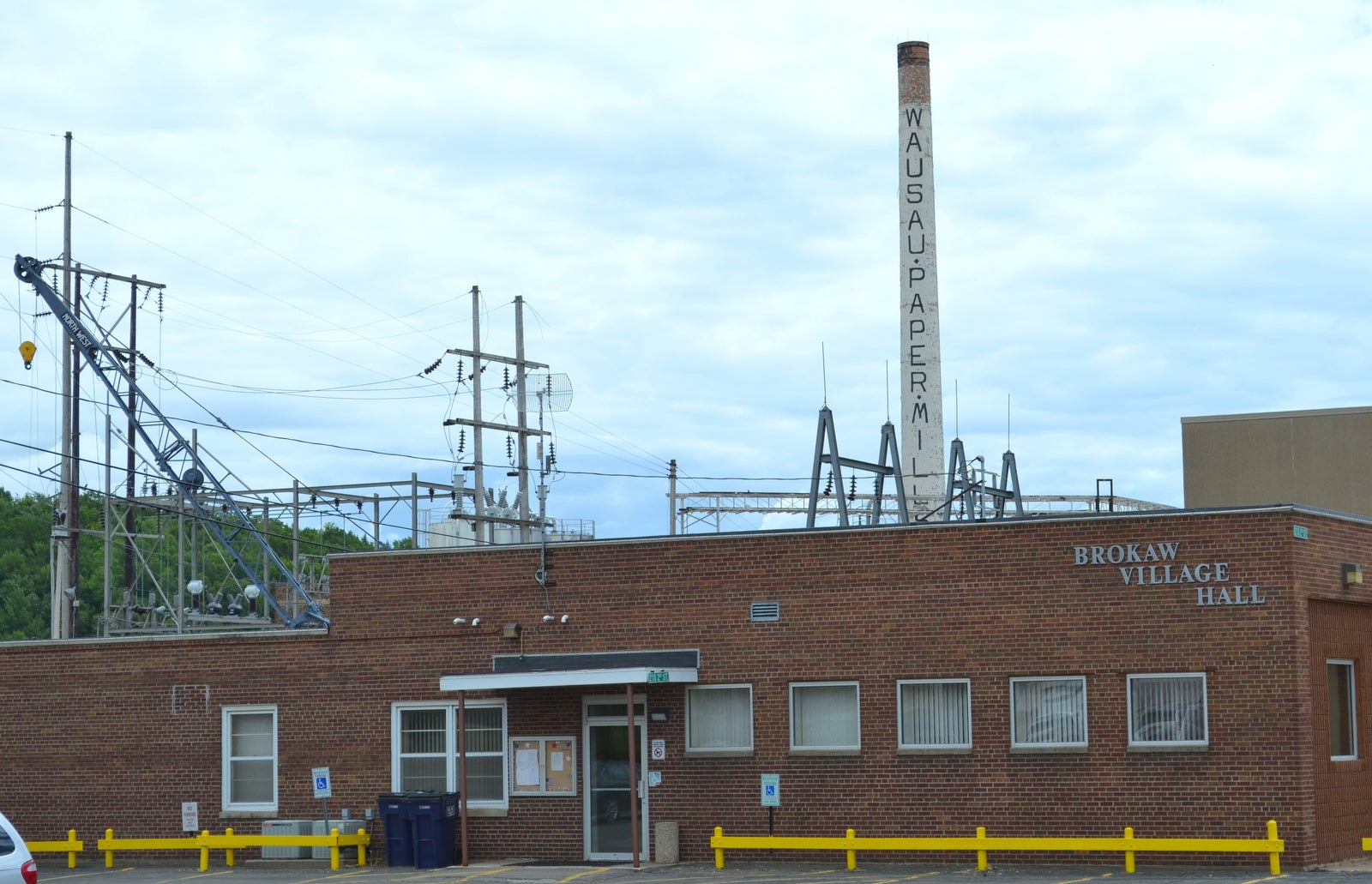 Brokaw Village Hall sits in the shadow of the shuttered Wausau Paper mill