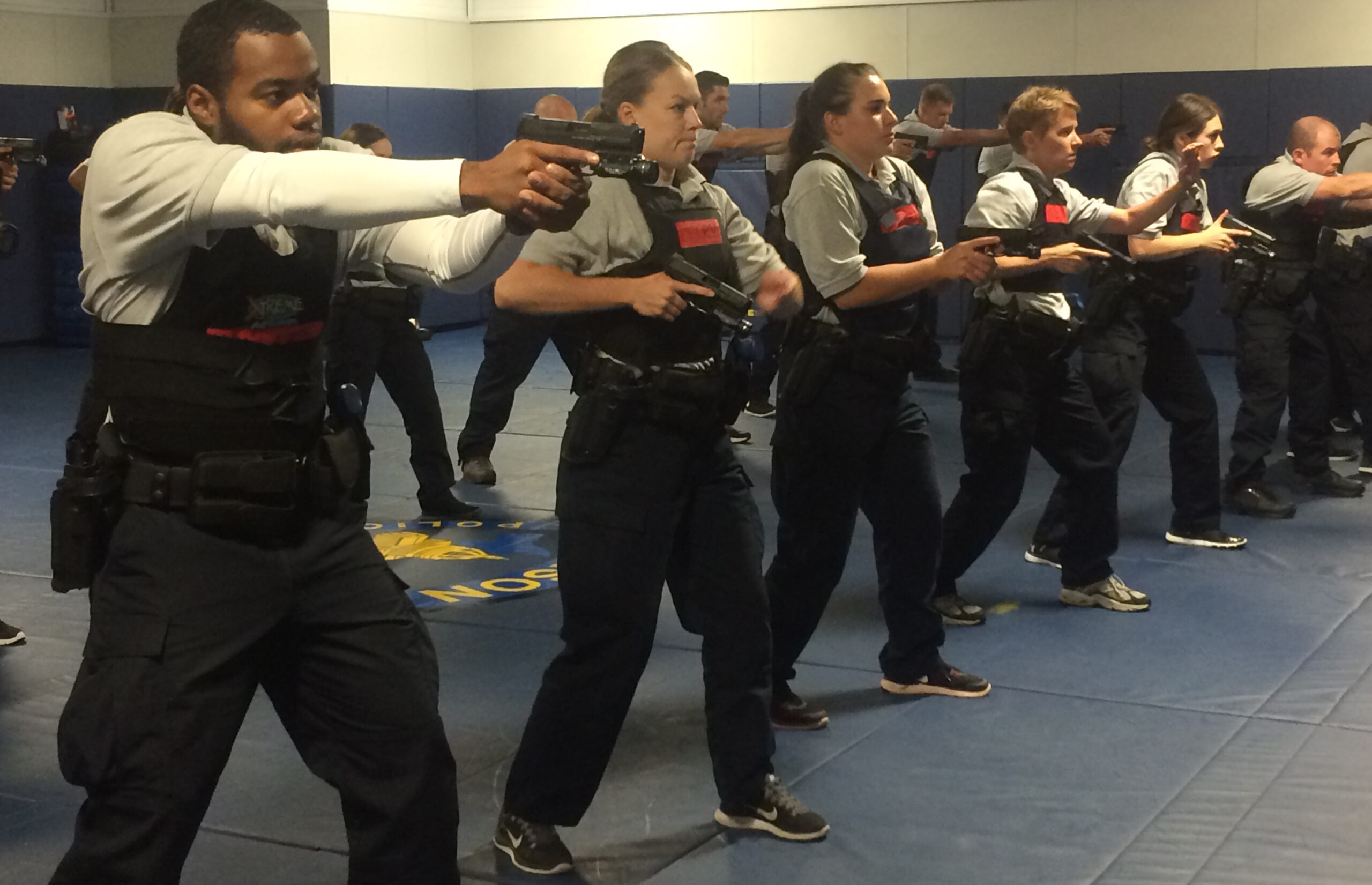 Madison Police recruits learn the steps of drawing their weapons at the Madison Police Training Center.