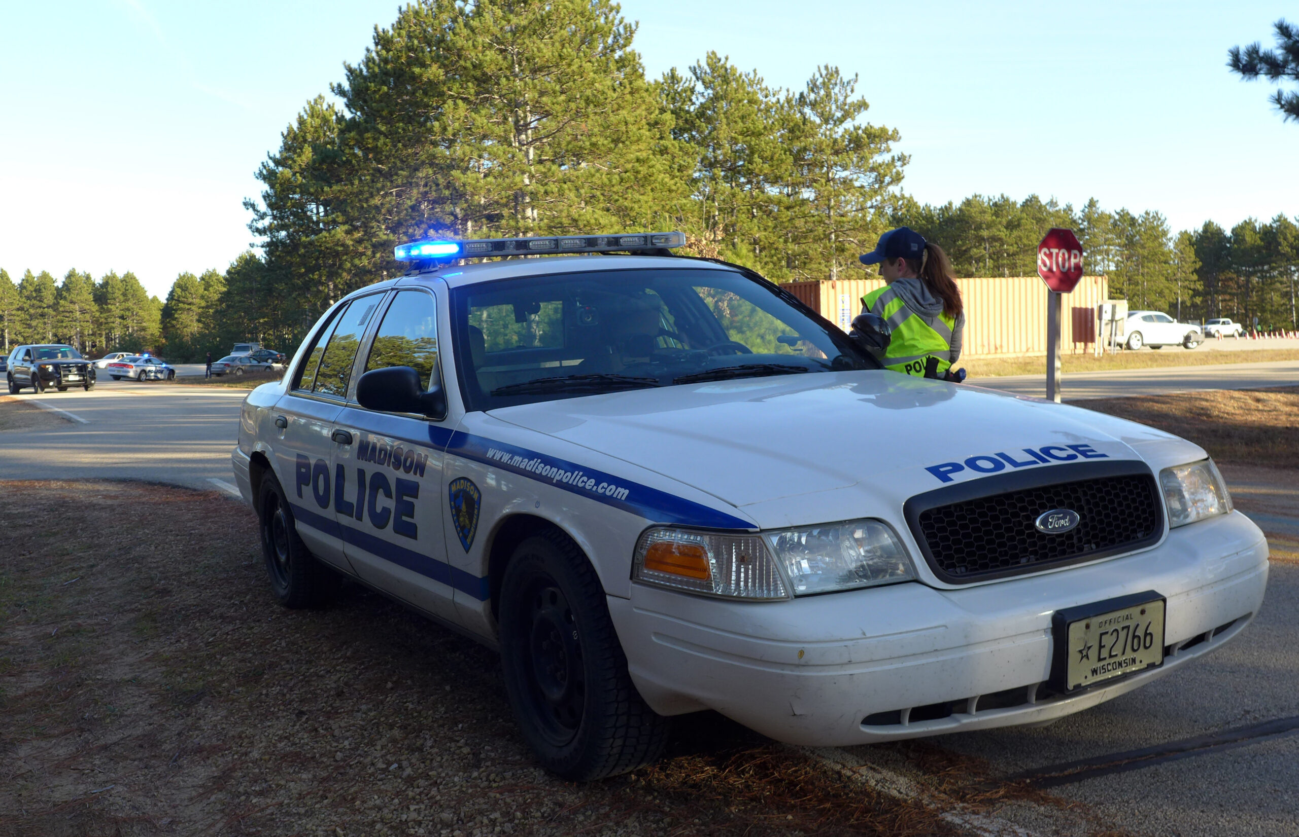 Recruit Stephanie Nelson returns to her squad car during a training exercise.