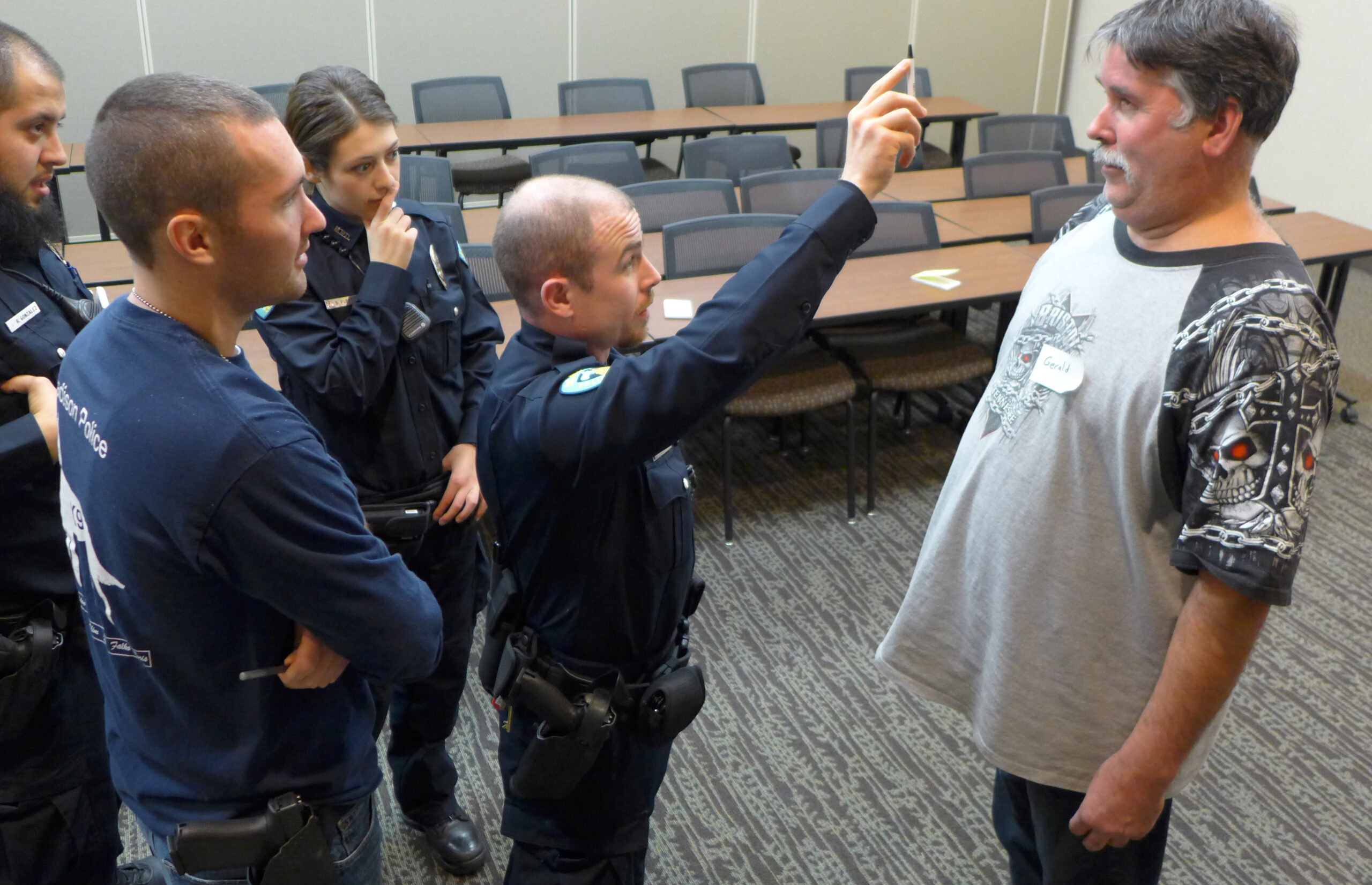 Recruit Nick Cleary practices field sobriety testing on a volunteer who is drunk.