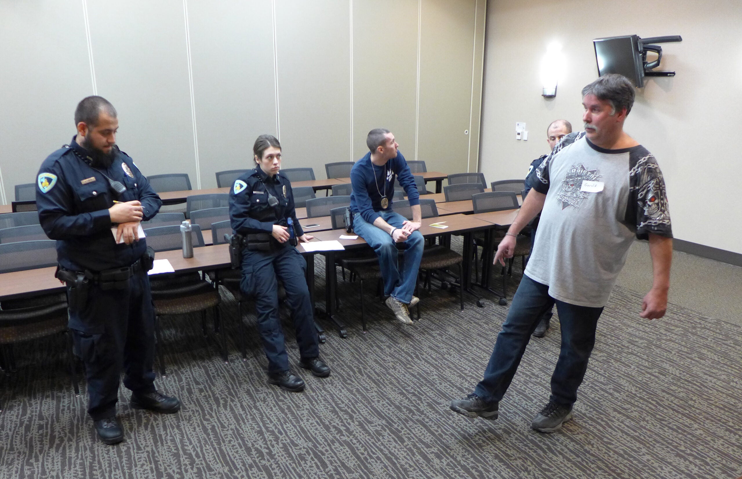 Madison Police recruits Ruben Gonzalez and Brenna Puestow practice field sobriety testing on a volunteer who has been drinking.
