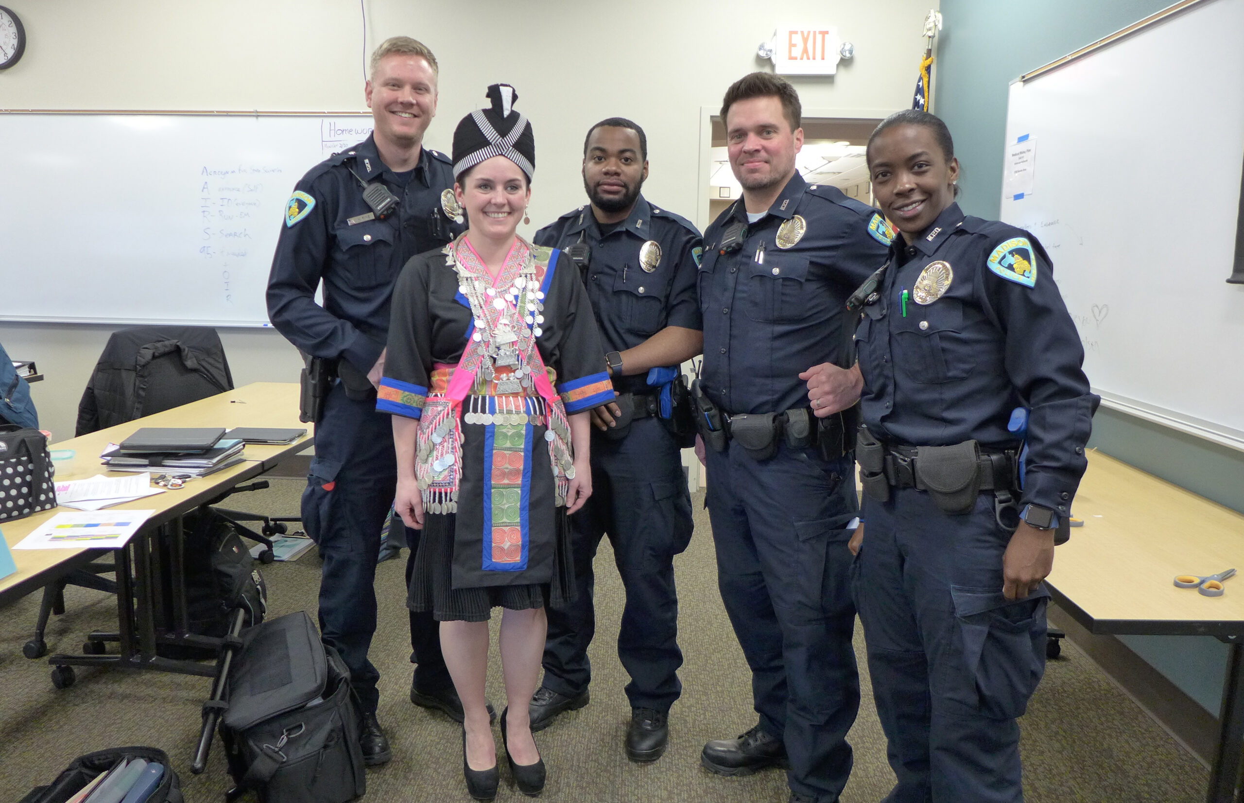 Madison Police recruits, left to right, Nick Pine, Stephanie Nelson, Ray Gillard, Mark Gulden and Lyjya Miles pose during a cultural competence class about Hmong culture.