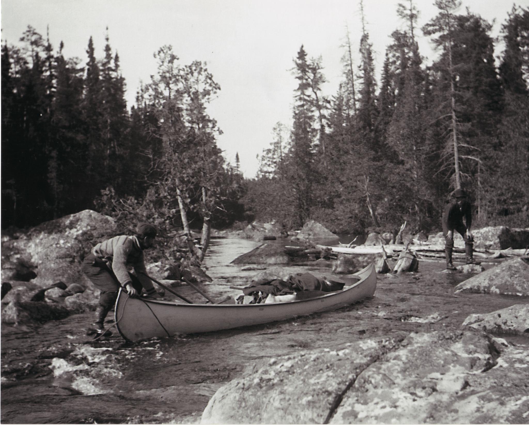 lowering canoe down rapids