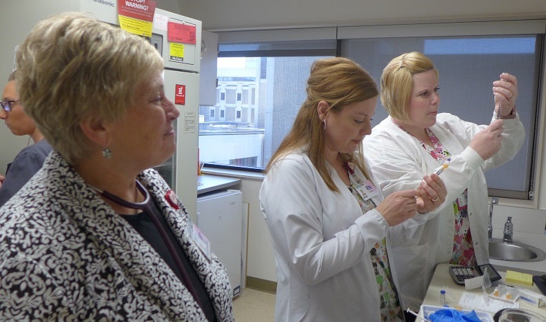 Picture of Dr. Ann Budzak and nurses