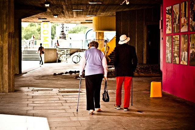 Two older adults walker