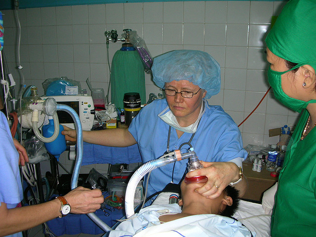 Doctors Administering Anesthetic