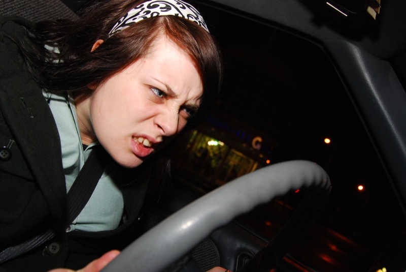 Angry girl at steering wheel