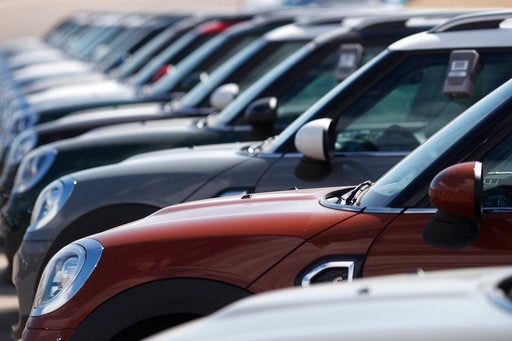 In this Monday, March 12, 2018, photograph, a long row of 2018 Countryman models is shown at a Mini Cooper dealership in Highlands Ranch, Colo.