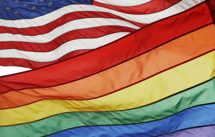 A photo showing the Rainbow flag superimposed on an American flag