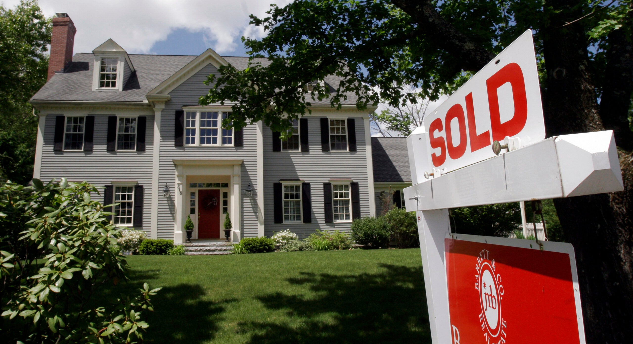 sold sign in front of house