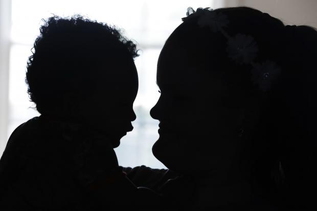 Silhouette of child, adult