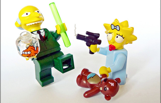 A lego recreation of Maggie Simpson shooting Mr. Burns