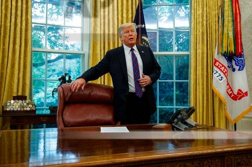 President Donald Trump arrives for a phone call