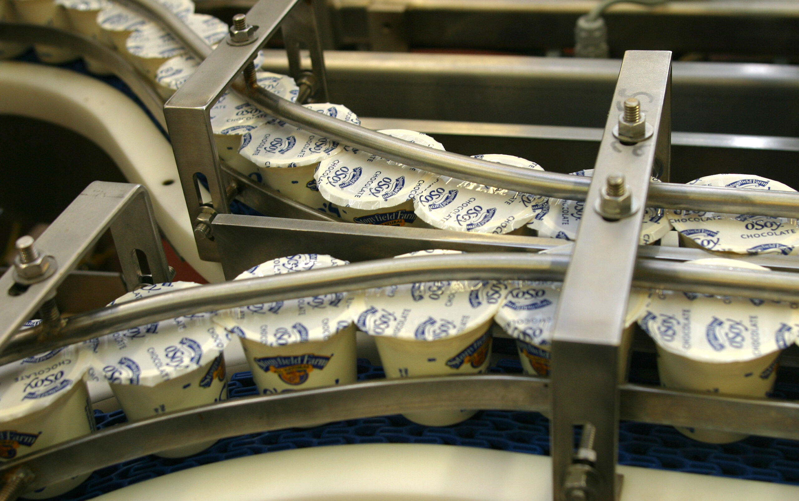 Stonyfield Farm's Chocolate O'Soy rides a conveyor on it's way to packaging