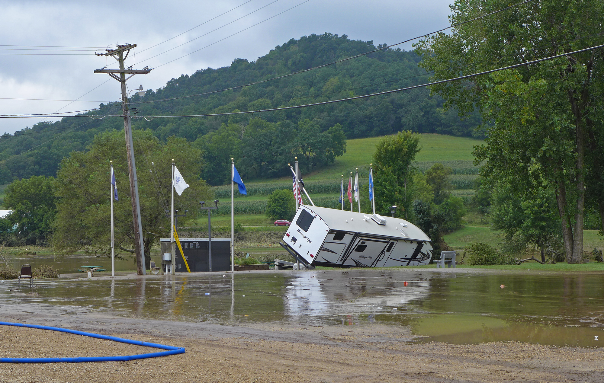 An RV floated into the American Legion's flag poles