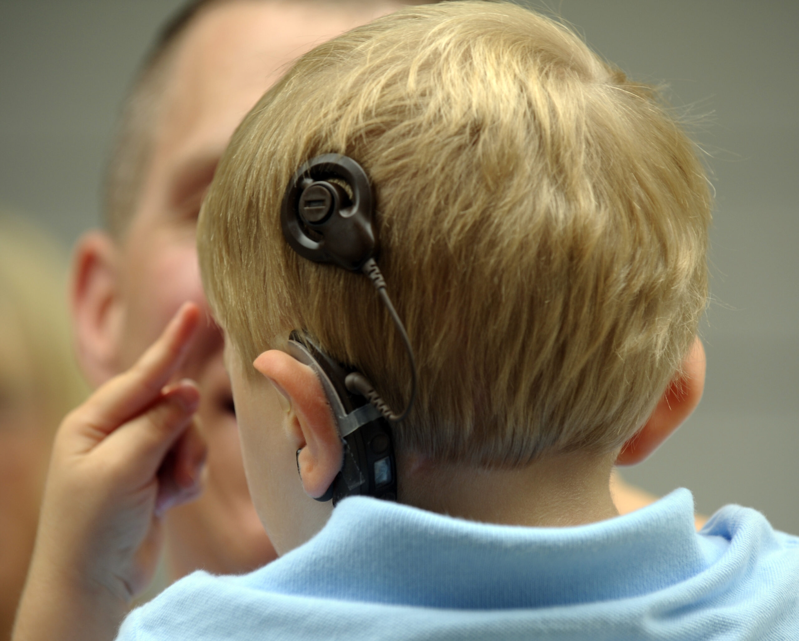 Boy with cochlear implant